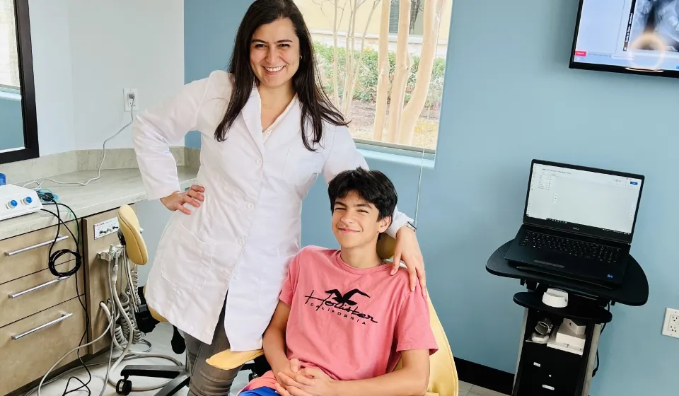 Dr. Azi of Smile in Style with a patient at her Cedar Park dental office